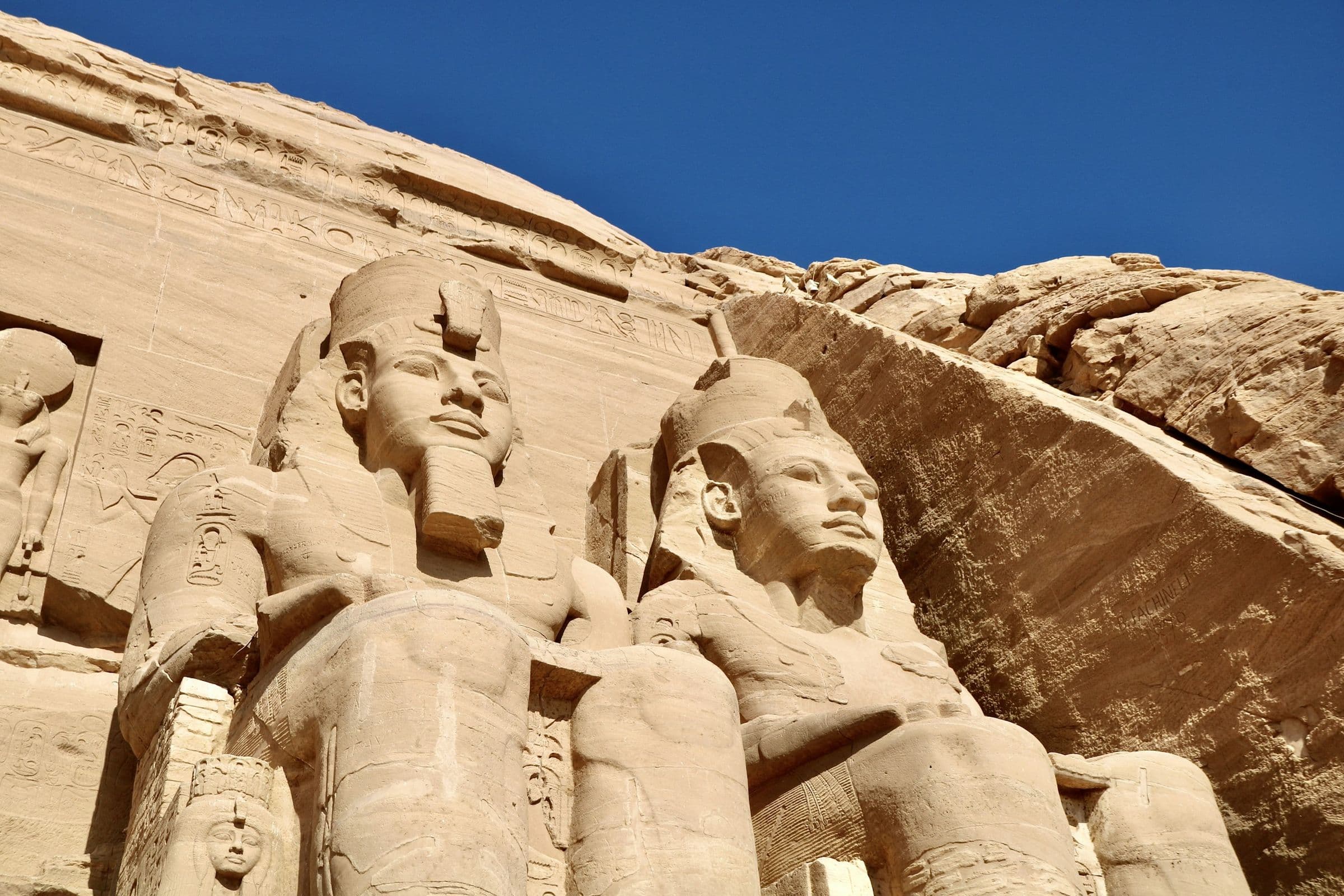 Close view of the carved faces of Ramses II at Abu Simbel