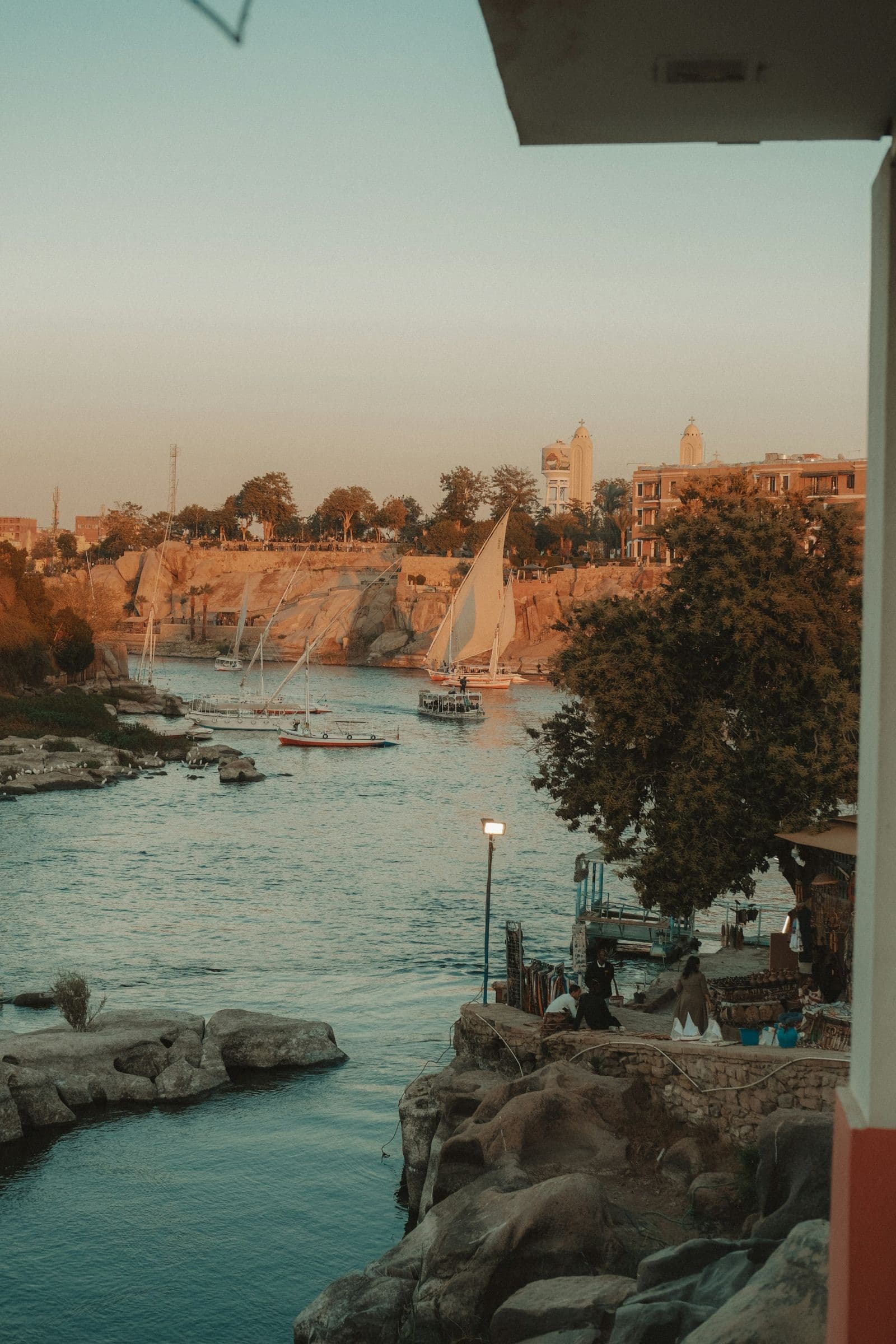 Feluccas moored among the granite rocks of the Nile at Aswan